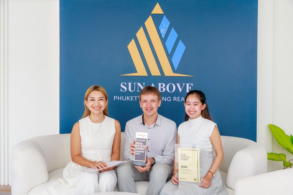 The Sun Above Phuket team with the Thailand Real Estate Agent Awards 2025 trophy at the Bang Tao office